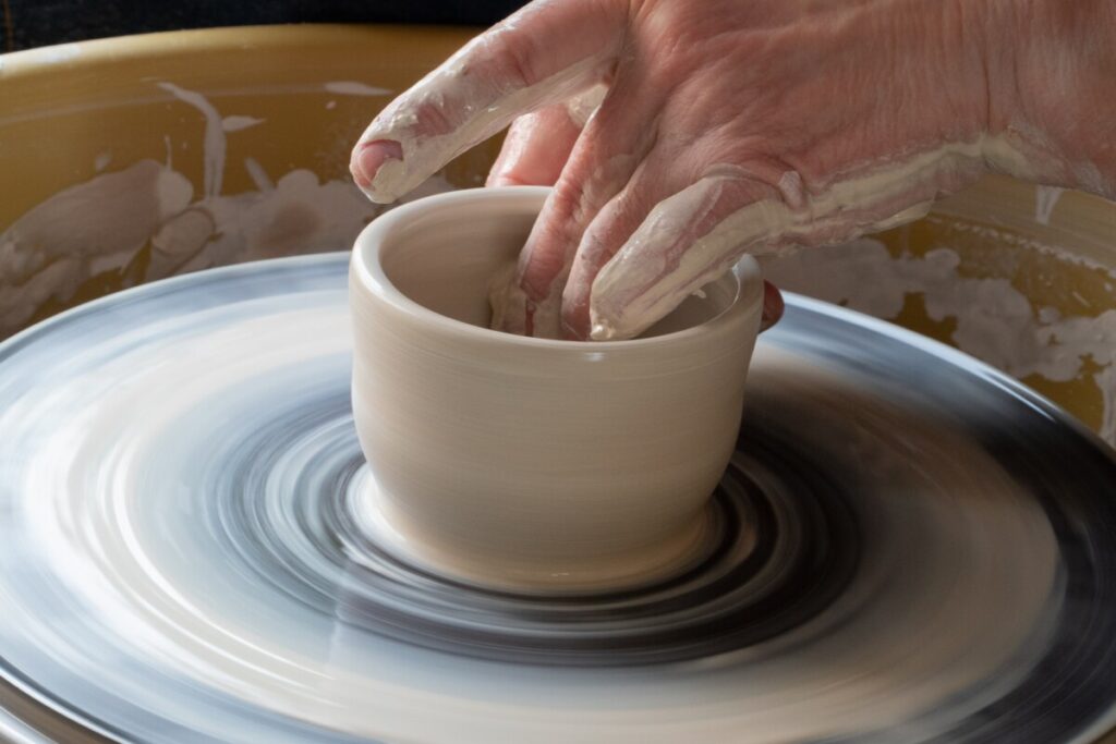 a person doing pottery