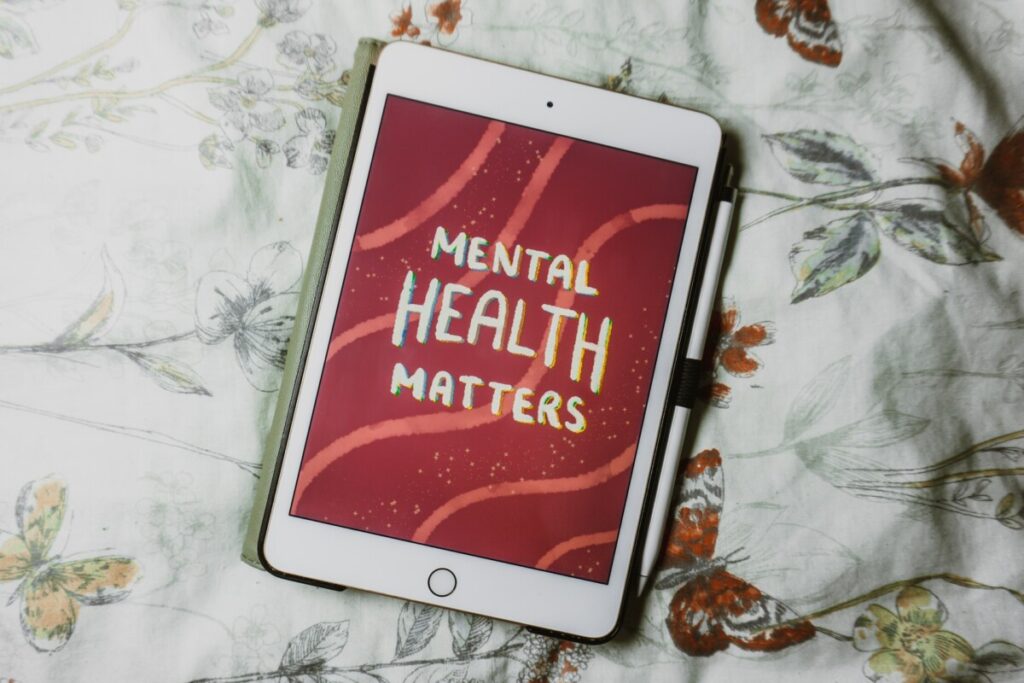 a tablet showing a text of mental health matters