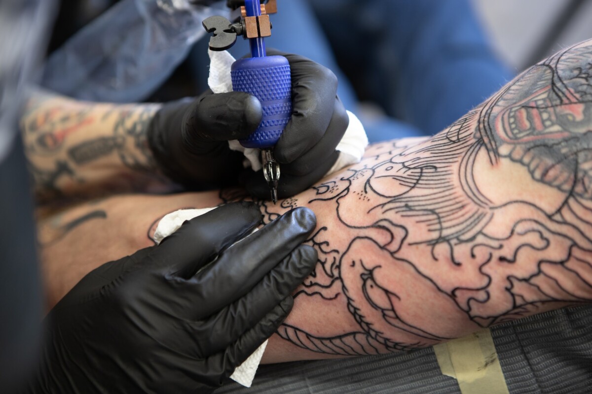 A tattooing process involving disposable needles